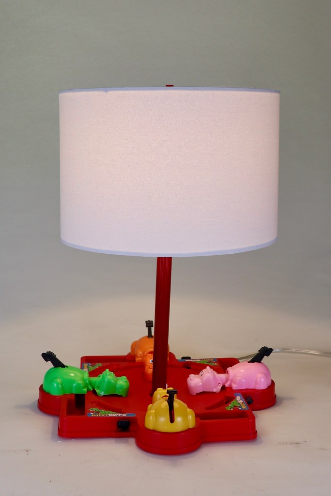 Hungry Hungry Hippos game with red base and colorful hippos